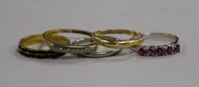 An 18ct gold and black enamel mourning ring and four other rings, including an 18ct white gold and