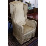 A silk damask wingback armchair