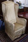 A silk damask wingback armchair