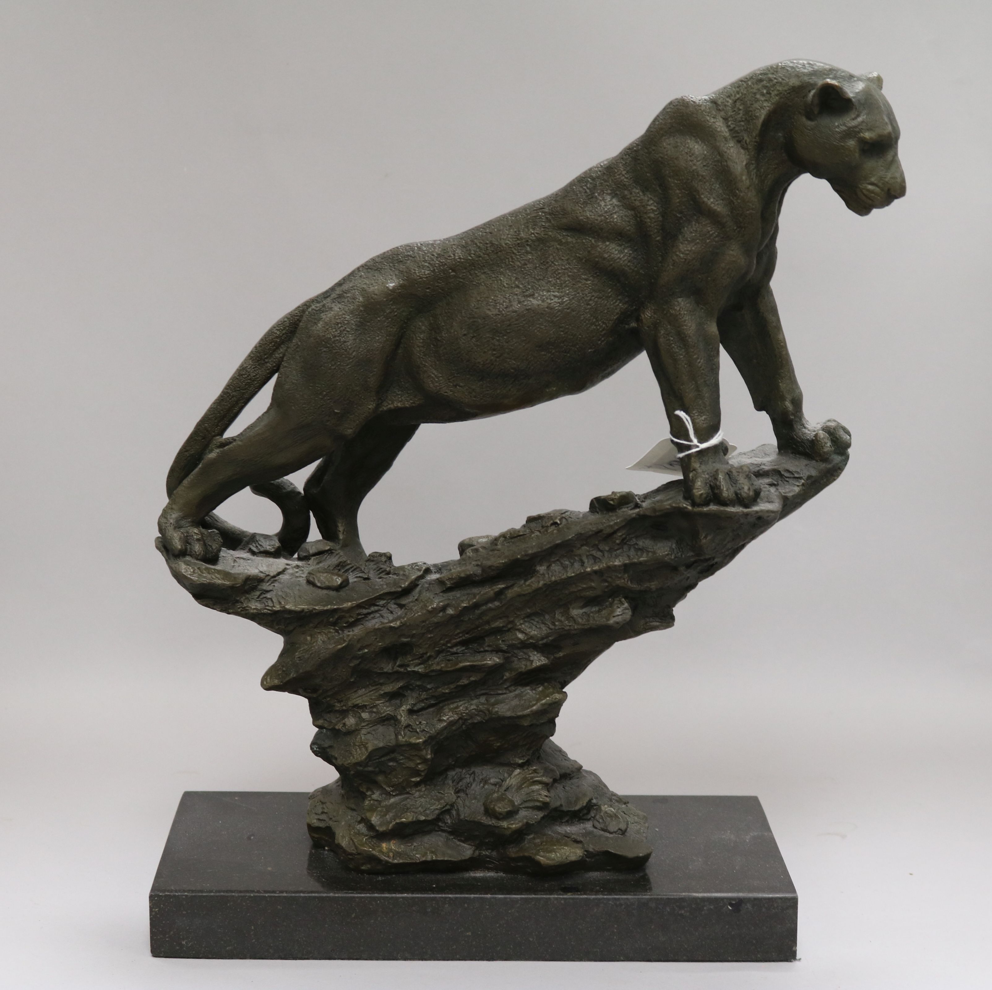 A bronze model of a mountain lion signed Pougatti by Talos Gallery on marble base height 39cm