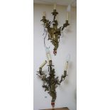 A pair of three branch ormolu wall lights length 55cm