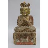 A Chinese gilt and polychrome wood seated figure of Buddha height 32cm