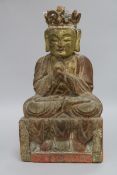 A Chinese gilt and polychrome wood seated figure of Buddha height 32cm