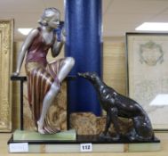 An Art Deco onyx and bronze spelter figure and dog group height 40cm