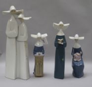 A Lladro group of two nuns and three other figures of nuns, one reading, one seated with sewing
