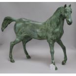 A green bronze model of a stallion height 47cm width 60cm