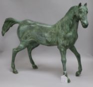 A green bronze model of a stallion height 47cm width 60cm