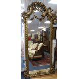 A large ornate giltwood wall mirror W.95cm