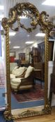 A large ornate giltwood wall mirror W.95cm