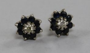 A pair of 18ct gold, sapphire and diamond cluster ear studs.