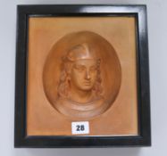 A terracotta portrait plaque in ebonised frame height 27cm width 25cm