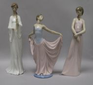 A Lladro figure, Dancer, No. 5050 and two other figures, The Lady of the Rose, No. 6857 (rose