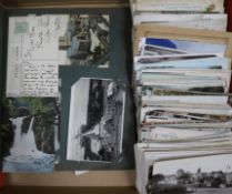 A postcard album, loose postcards and greeting cards