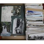 A postcard album, loose postcards and greeting cards