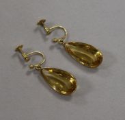 A pair of yellow metal earrings, set pear-shaped facet-cut citrine drops.