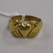 A yellow metal claddagh ring, the central heart carved with initials 'G H', the inner shank dated