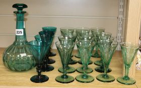 A Victorian green glass decanter and thirteen glasses and three others