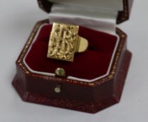 A yellow metal signet ring, the rectangular matrix applied with initials 'A S' (tests as 18ct gold),