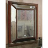 A velvet framed mirror W.71cm, worn