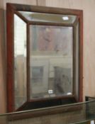A velvet framed mirror W.71cm, worn