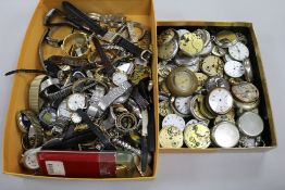 A large quantity of assorted pocket watches and wrist watches.