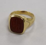 A 22ct yellow gold signet ring, the carnelian matrix carved with initials, size M, 8.6g