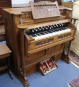 A Karn of Woodstock, Canada, oak cased reed organ W.131cm