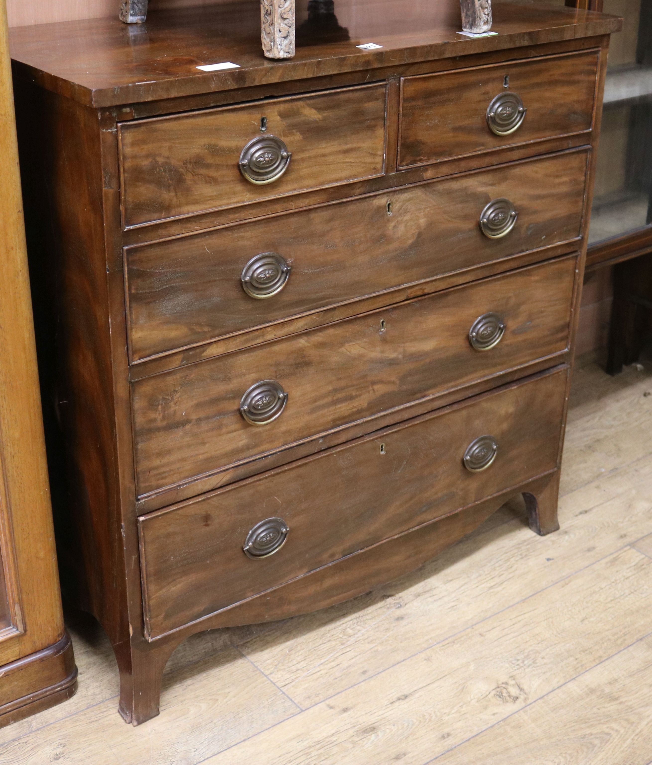 A 19th century mahogany chest of two short and three long drawers over swept legs W.93cm