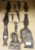 A quantity of bronze religious plaques tallest 22cm