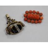 A gilt and chalcedony set spinning fob seal and coral brooch.