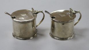 A pair of George V silver drum mustards, Thomas Bradbury & Sons, Sheffield, 1923 and a pair of