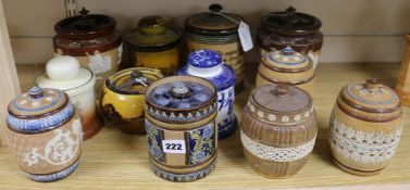 Twelve Doulton tobacco jars and covers, various designs