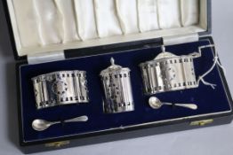A modern cased three piece silver condiment set and pair of condiment spoons, A Chick & Sons Ltd,