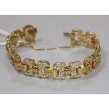 A yellow metal and diamond set fancy link bracelet, sixteen of the links each set with twelve