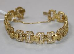 A yellow metal and diamond set fancy link bracelet, sixteen of the links each set with twelve
