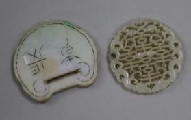 A Chinese carved and pierced jade disc and one other (2)