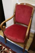 A 19th century French mahogany scroll armchair