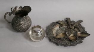 An Indian white metal jug and dish, a silver mounted glass match tidy and three Scottish silver