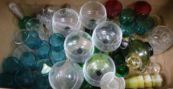 A collection of green and cranberry glassware