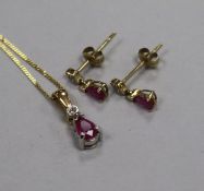 A modern 9ct gold, ruby and diamond set suite of jewellery, comprising pendant on chain and pair