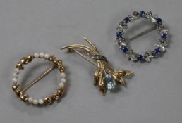 Three 9ct gold and gem set brooches, including white gold.