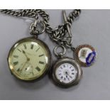 An early 20th century silver pocket watch on a silver albert chain and a silver fob watch.