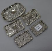 Two pairs of Edwardian repousse silver small dishes and a larger Victorian dish, maker includes