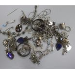 A group of assorted mainly silver jewellery including filigree locket on chain, bracelets etc.