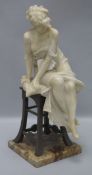 A 1930's alabaster seated model of a lady height 40cm