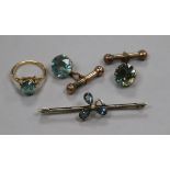 A 15ct gold and blue zircon ring, an early 20th century 15ct gold and gem set bar brooch and a