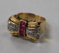 A 1950's yellow metal, diamond and gem set cocktail ring, size M.