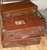 Four leather suitcases
