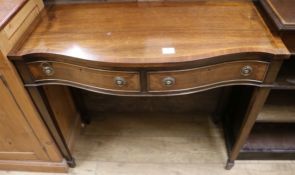 A George III style mahogany and line inlaid serpentine fronted two drawer side table W.98cm