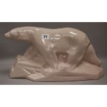 A pink glazed crackleware Deco polar bear height 21cm width 39cm